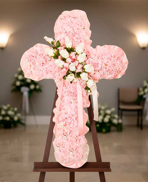 Creu de flors rosades